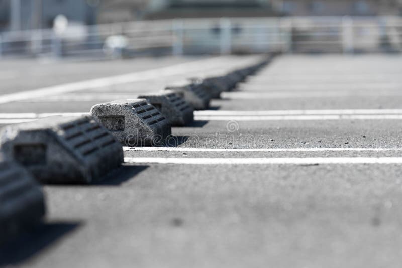 Concrete Parking Block Stopper At The Parking Lot In Japan. Stock Photo