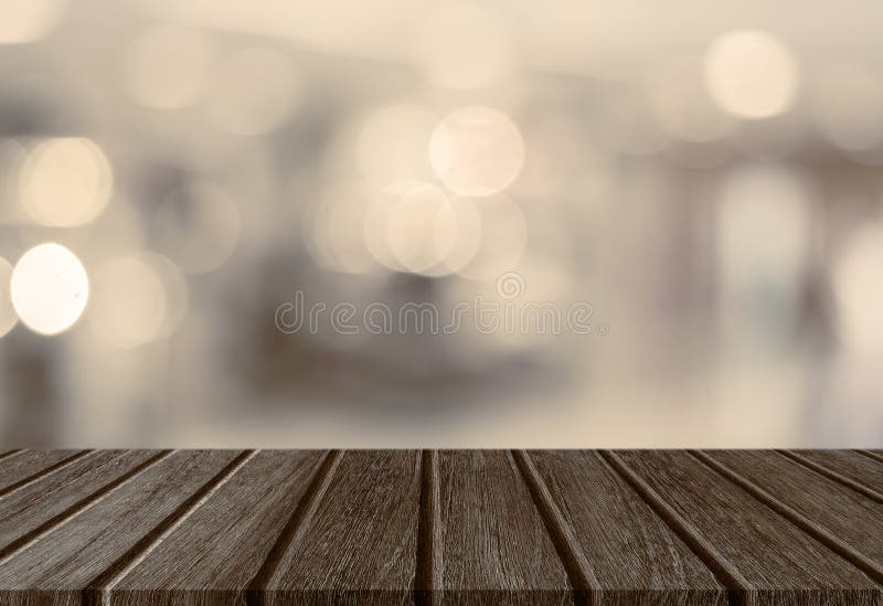 Empty perspective wood plank table top with abstract bokeh light background royalty free stock images Empty perspective wood plank table top with abstract bokeh light background royalty free stock images