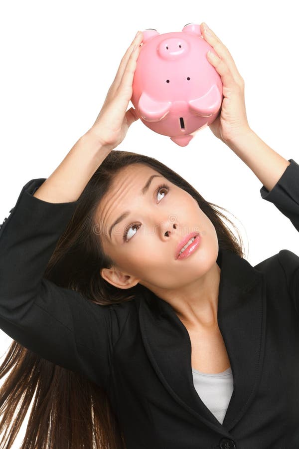 Empty piggy bank. Money debt, bankruptcy and lost savings concept. Business woman or banker showing empty pink piggy bank isolated on white background. Empty piggy bank. Money debt, bankruptcy and lost savings concept. Business woman or banker showing empty pink piggy bank isolated on white background.