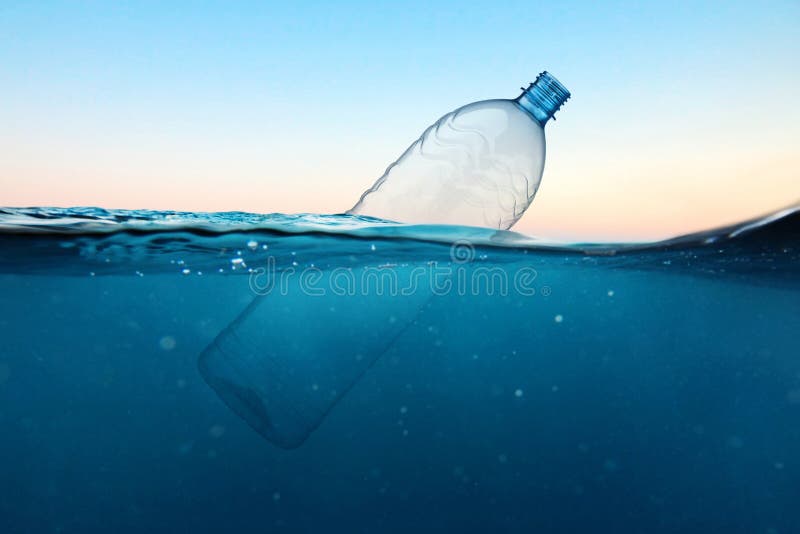 Empty plastic bottle floats in water. Ocean pollution concept. Global warming. View under water. Empty plastic bottle floats in water. Ocean pollution concept royalty free stock image Empty plastic bottle floats in water. Ocean pollution concept. Global warming. View under water. Empty plastic bottle floats in water. Ocean pollution concept royalty free stock image