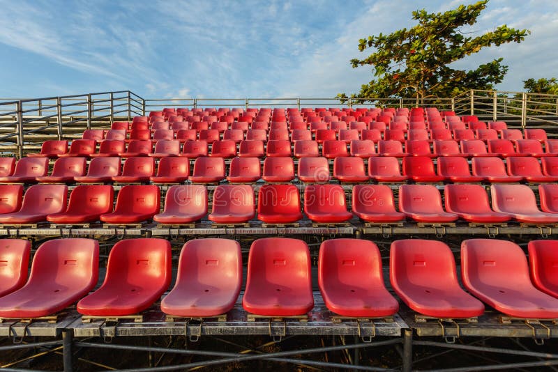 Empty plastic chairs at temporary grandstand stadium in Phuket stock photography