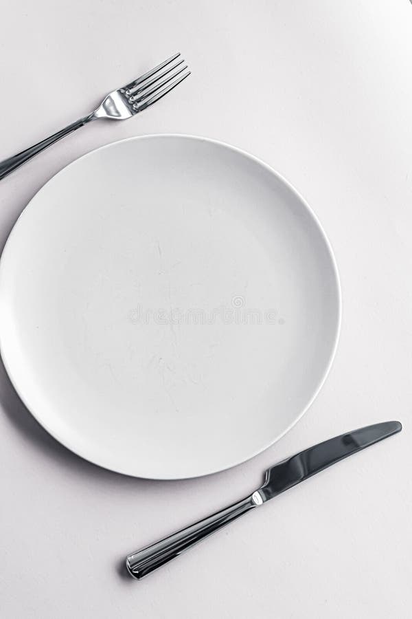 Download Empty Plate And Cutlery As Mockup Set On White Background ...