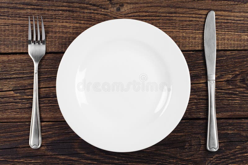 Empty plate, fork and knife