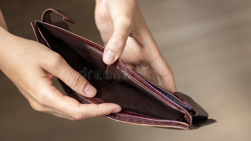 Broke Businessman With Empty Purse And Polish Coins Stock Photo |  Royalty-Free | FreeImages