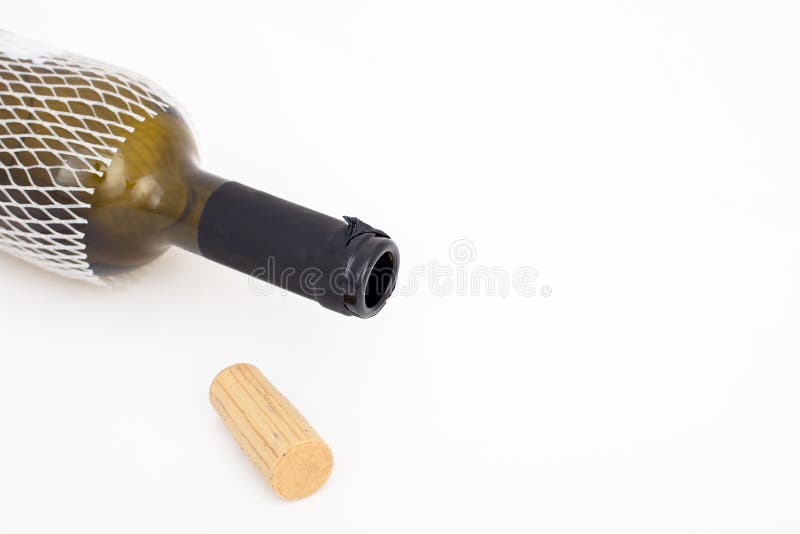 Empty red wine bottle and cork isolated on white background