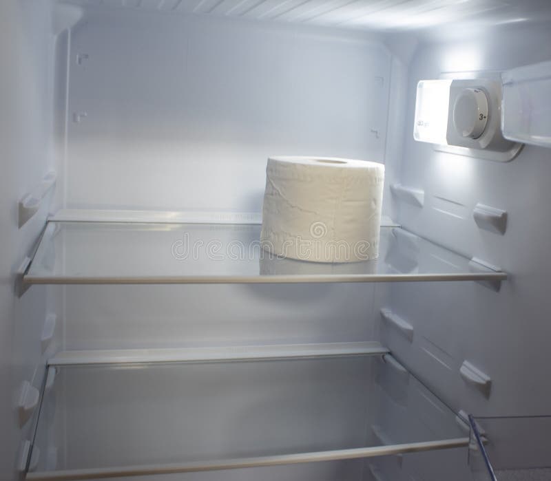 Empty Refrigerator. Toilet Paper in an Empty Refrigerator Stock Photo