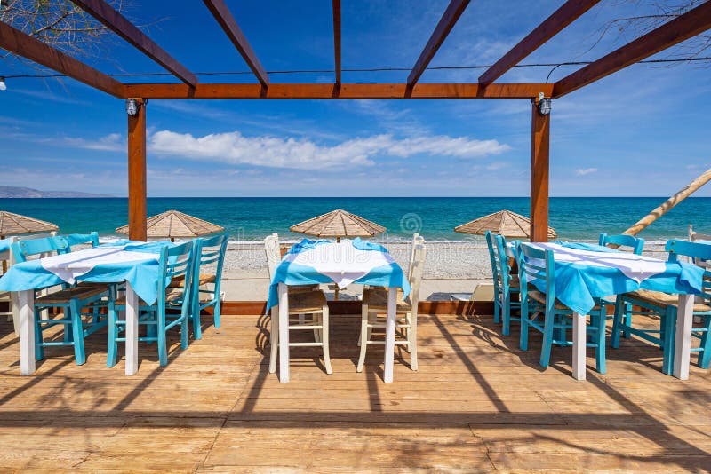Empty Restaurant Tables at the Maleme Beach on Crete, Greece Stock