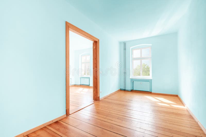 Empty room in renovated  flat with green painted walls