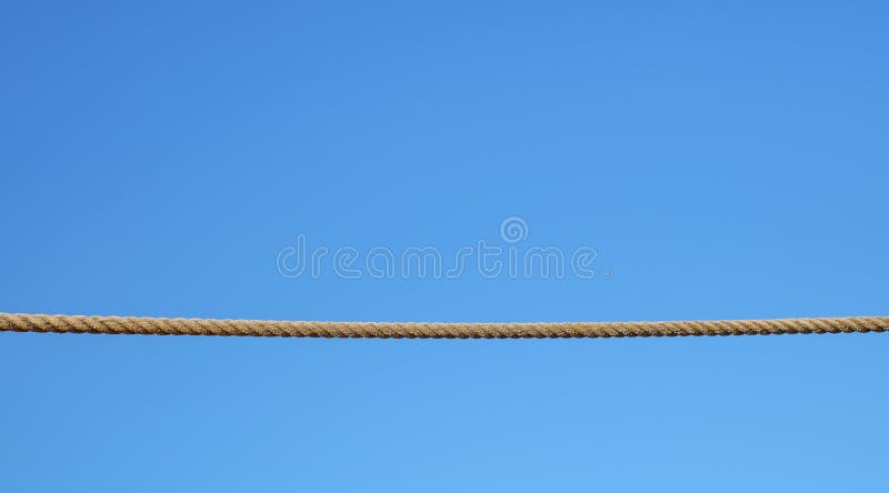 A Empty Rope Stretched on a Blue Background Stock Image - Image of