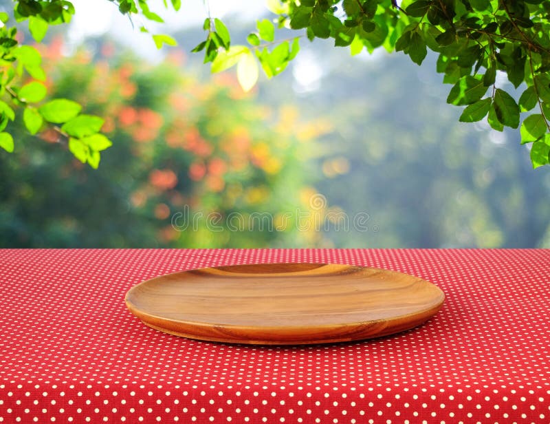 Download Empty Round Wooden Tray On Red Polka Dot Tablecloth Over Blur Tr Stock Image - Image of cover, outdoor: 54867395