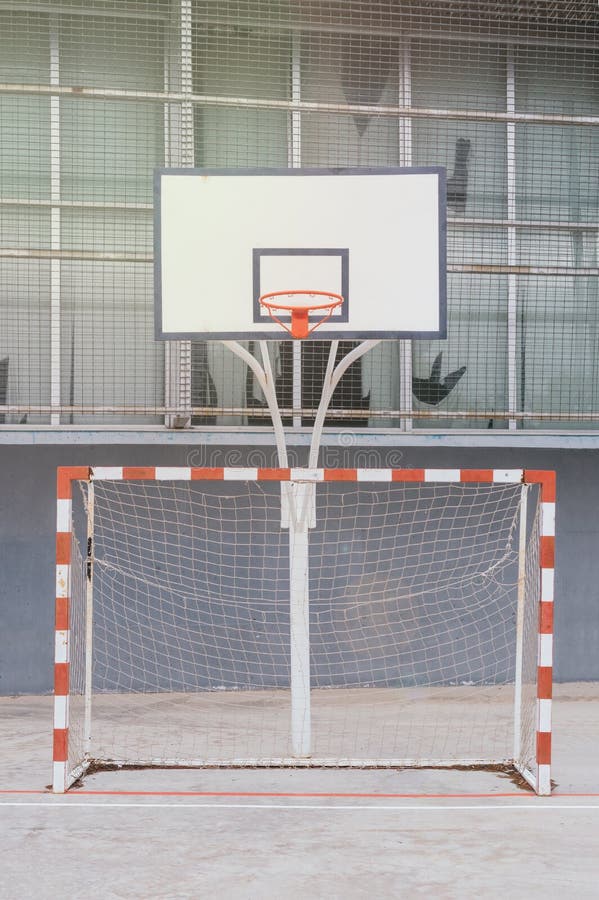 Soccer Goal and a Basketball Hoop in a School Playground Stock Image