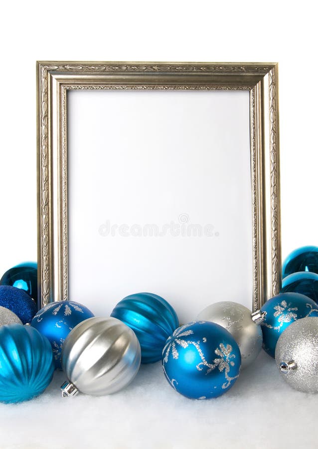 An Empty Silver Picture Frame with Blue and Silver Christmas Ornaments