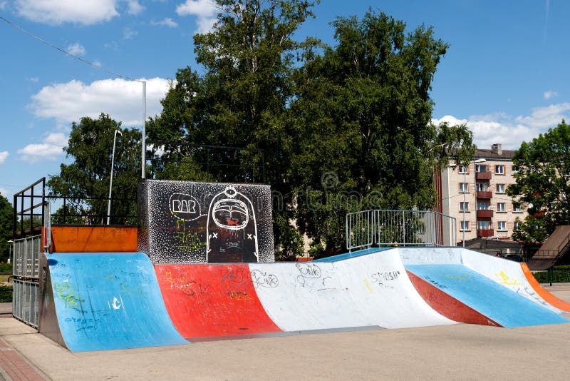 Empty skate park with colored ramps