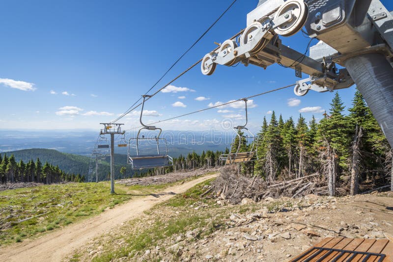 An empty ski lift not operating during summer at the Mt Spokane State Park ski resort overlooking Spokane Washington stock photo An empty ski lift not operating during summer at the Mt Spokane State Park ski resort overlooking Spokane Washington stock photo