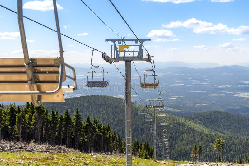 An empty ski lift during summer at the Mt Spokane State Park ski resort overlooking Spokane, Washington. stock image An empty ski lift during summer at the Mt Spokane State Park ski resort overlooking Spokane, Washington. stock image