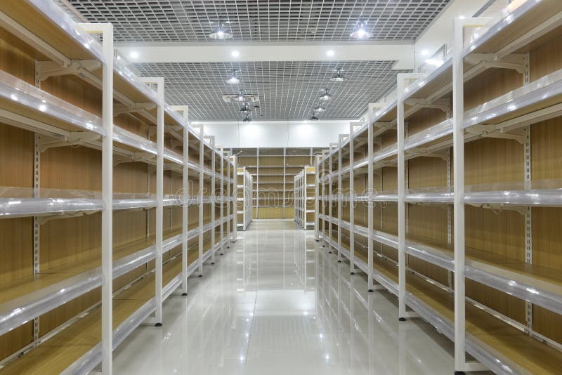 Empty shelves of supermarket interior