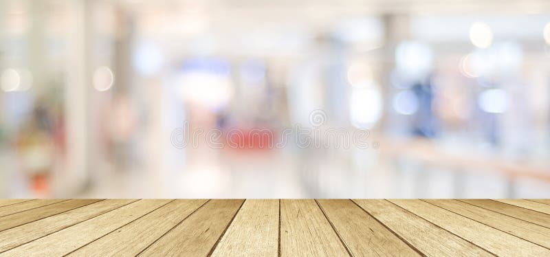 Empty table, perspective wood, over blurred store with bokeh background, product display montage background, banner royalty free stock photography