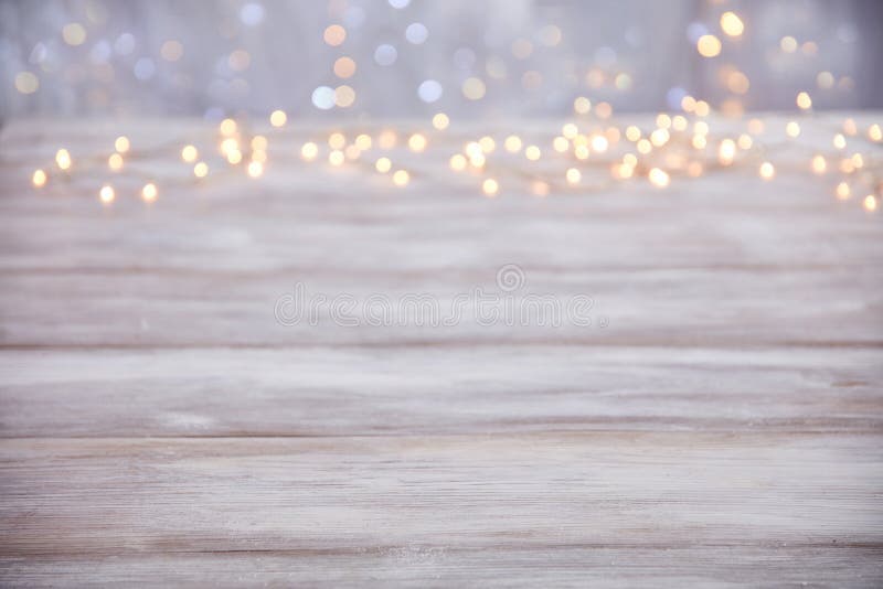Empty table top with blur christmas lights background royalty free stock photo
