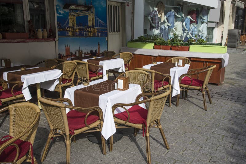 Empty tables and chairs outside of the restaurant in old city. stock photography Empty tables and chairs outside of the restaurant in old city. stock photography