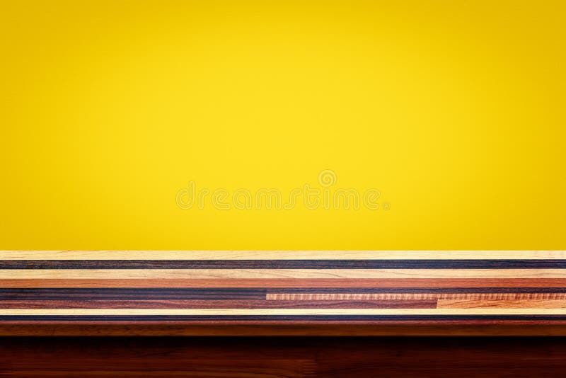 Empty Top of Wooden Table on Yellow Gradient Wall Background. Stock