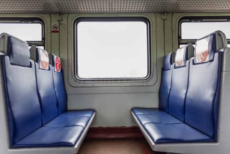 An Empty Train Car with Markings for Seating Passengers during the
