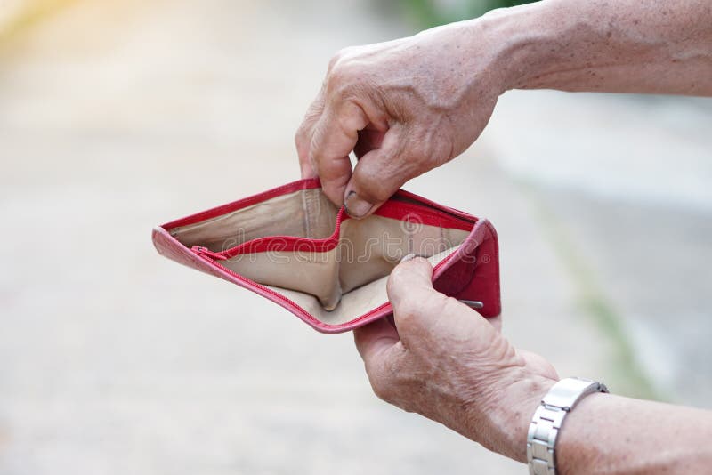 Man wears jeans, turning out pockets to show empty pocket. Make hands  gesture to show no money. Concept, economic crisis. Financial problems.  Broke at the end of month. Lost money. 14880296 Stock