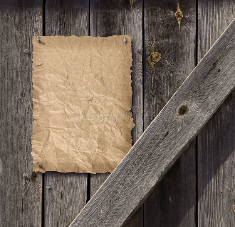 Empty Wanted poster on weathered plank wood door