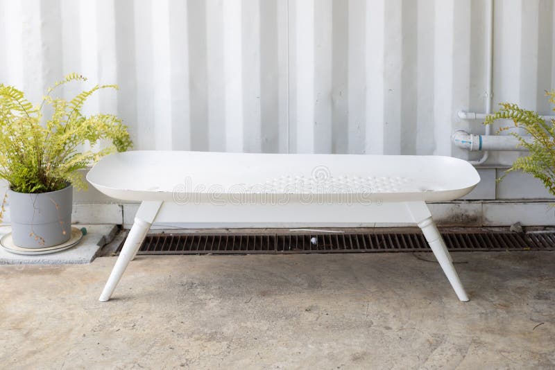 Empty bathtub bench or tub seat with sheet metal corrugated wall background stock image Empty bathtub bench or tub seat with sheet metal corrugated wall background stock image