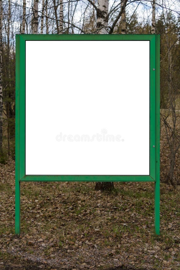 Empty white billboard with green frame and nature background royalty free stock photo