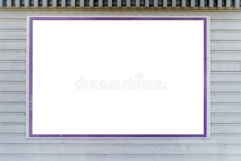 Empty white billboard with violet border on a wall royalty free stock photo