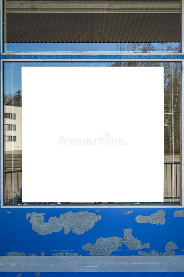 Empty white billboard on the window of an industrial building stock photography