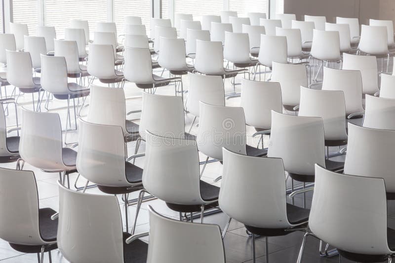 Empty White Chairs In Contemporary Conference Hall With Stock Image