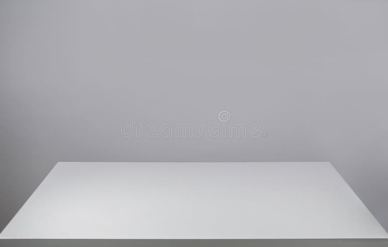 Empty white desk table and a blank grey wall for copy space. Graphic resource for design. Front view minimalist workspace. Board stock image