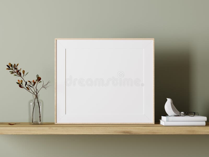 Empty white mock up picture frame on wooden shelf with green plant decoration