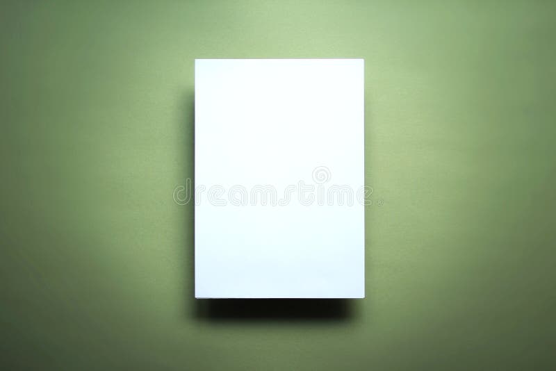 Empty white paper sheet green background