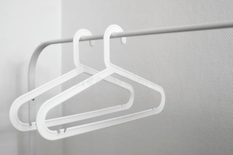 Empty White Plastic Clothes Hangers Stock Image - Image of home, boutique:  122348787