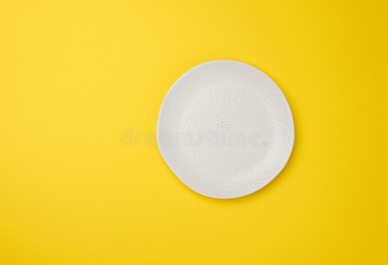 Empty White Plate on White Yellow Background, Top View Stock Photo