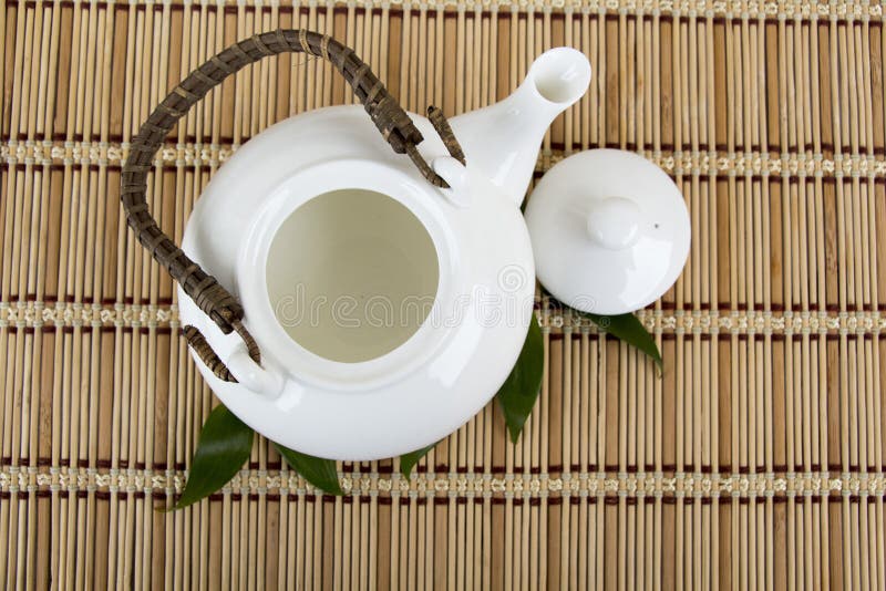 Empty White Teapot on Bamboo Mat Plate. Top View Stock Photo Image of