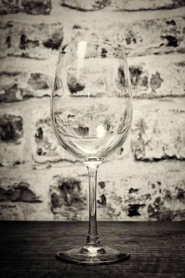 Empty wine glass against a rustic background stock photography