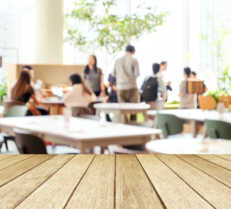 Empty wood perspective,table top, over blur group of people team royalty free stock images