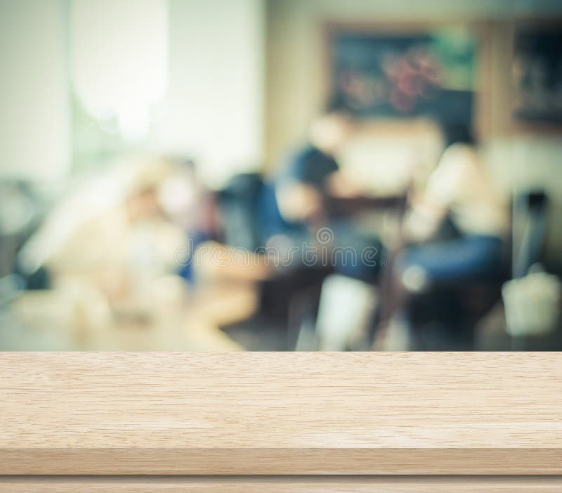 Empty wood table and blurred cafe with bokeh background stock photo