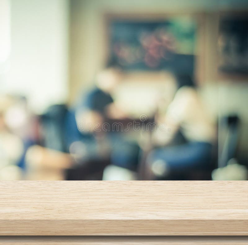 Empty wood table and blurred cafe with bokeh background royalty free stock images