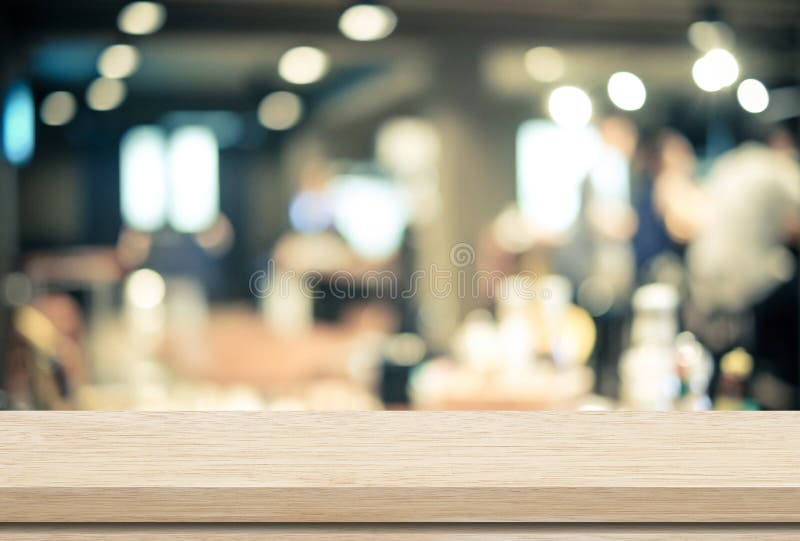 Empty wood table and blurred cafe with bokeh light background stock images