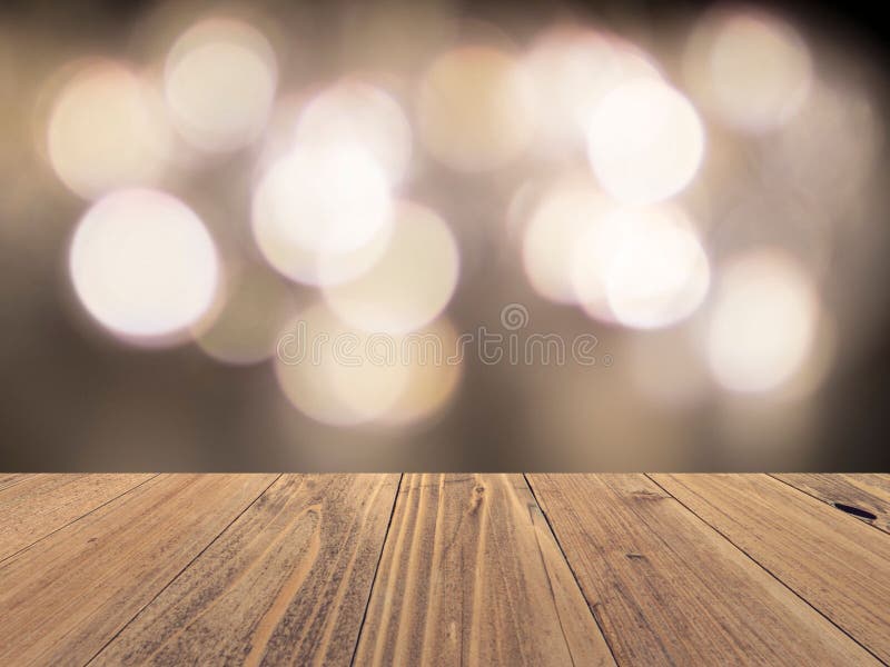 Bề mặt gỗ trống và nền bokeh ánh sáng mờ sẽ khiến bạn nhớ đến công việc của các nhà thiết kế nội thất chuyên nghiệp. Được tạo ra bởi background gỗ và đèn, hình ảnh này tạo ra một không gian mộc mạc và đầy sức sống để bạn trải nghiệm.