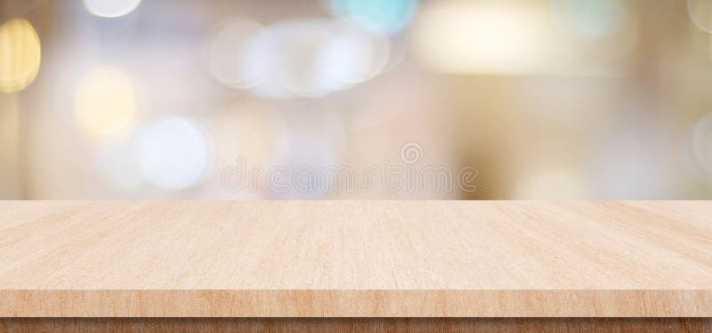 Empty wood table top, counter, desk background over blur bokeh background, Wooden table, shelf and blurred kitchen restaurant for stock photography