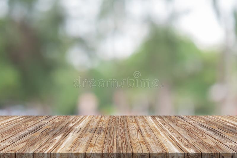 Empty wood table top on green blur background at garden royalty free stock photo Empty wood table top on green blur background at garden royalty free stock photo