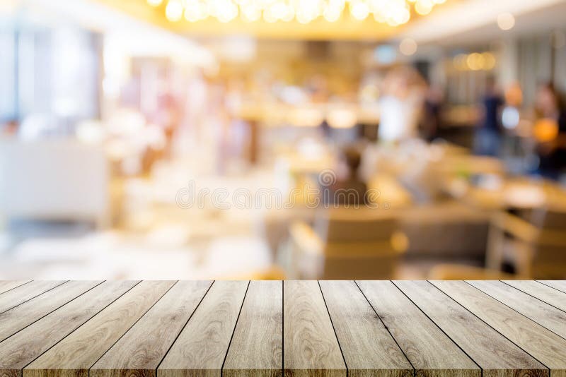 Empty wood table top with restaurant blur bokeh background royalty free stock images Empty wood table top with restaurant blur bokeh background royalty free stock images