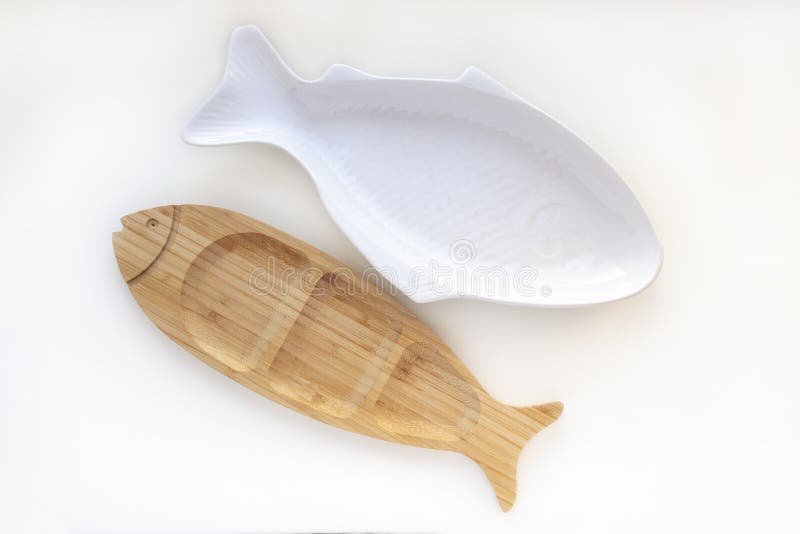 Empty Wooden and Ceramic Plates Fish Shaped Dish Isolated on White