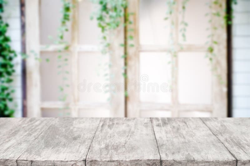 Empty wooden desk over blurred interior decoration background royalty free stock photo Empty wooden desk over blurred interior decoration background royalty free stock photo