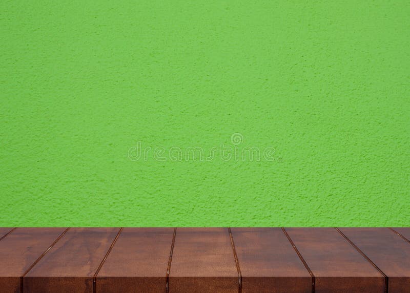 Empty wooden floor.Cement green wall background